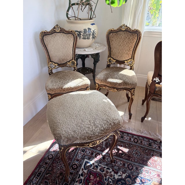 Elegant set of five vintage French Louis XV-style dining chairs accompanied by a coordinating upholstered stool, featuring...