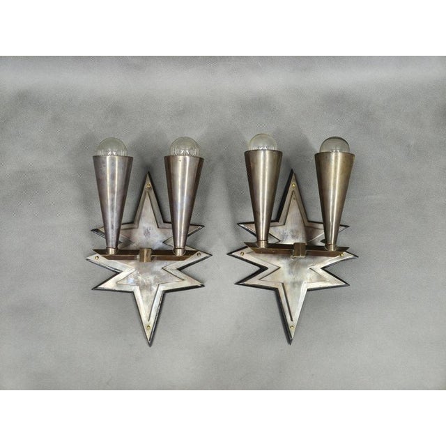 Rare pair of cubist wall lights produced in czechoslovakia during the 1920s featuring exceptional geometric star-shaped...