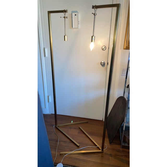 This listing is for a pair of modernist floor lamps. These lamps are identical and are the “Sabine” model by Arteriors...