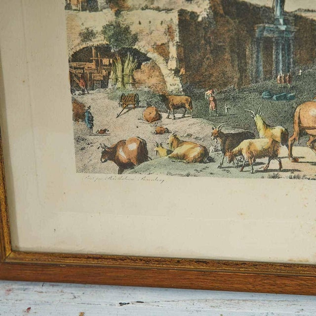 Framed antique engraving depicting a captivating landscape scene.