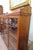 Antique tiger oak bookcase with adjustable height shelves and locking glass doors. Lovely carved details adorn the trim...
