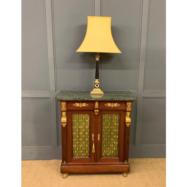 A splendid 19th century mahogany French Empire chiffonier, or side cabinet. Of excellent construction in mahogany with a...