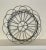 A small French Country inspired wire basket in a neutral, gray color. This versatile, adjustable basket could be...