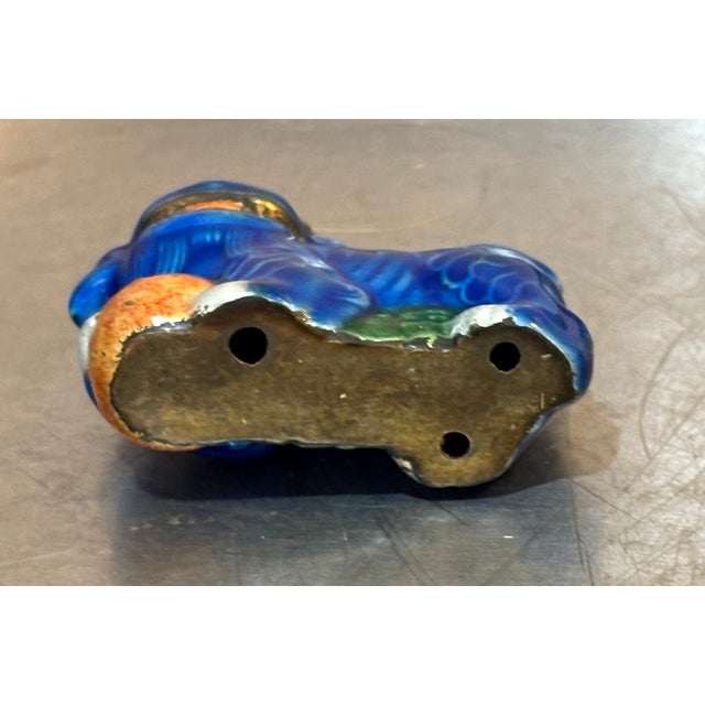 Dark blue mini ceramic/brass-base foo dog figurine. Excellent condition.