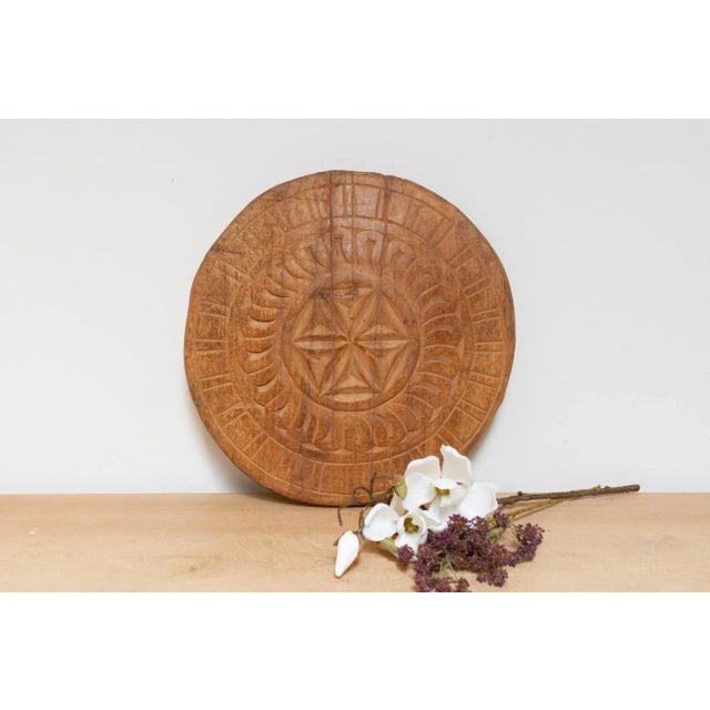 This finely carved vintage chapati plate, handcrafted from wood, brings a touch of global charm to your home. Originally...