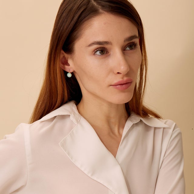 Created in 18 karat yellow gold Sea Green enamel details Diamonds 0.30 carat approx. French wire for pierced ears Limited...