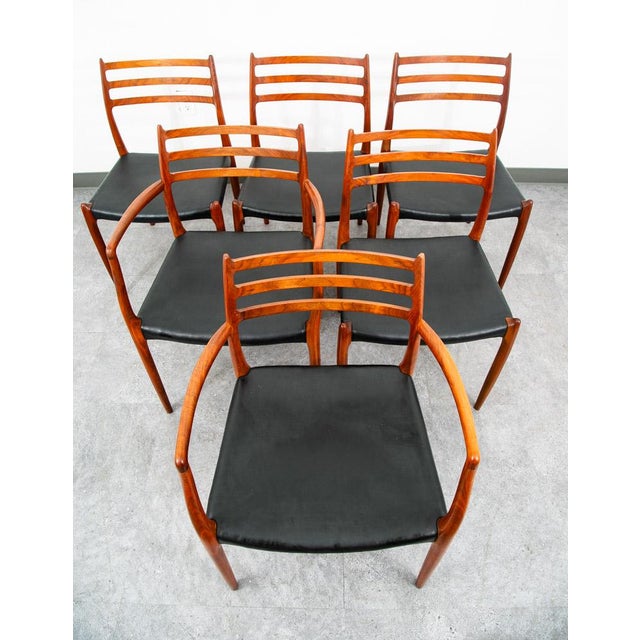 Set of 4 Niels Moller model 78 (x4) model 62 Armchair (x2) Danish Walnut Dining Chair set. The chairs feature a solid...