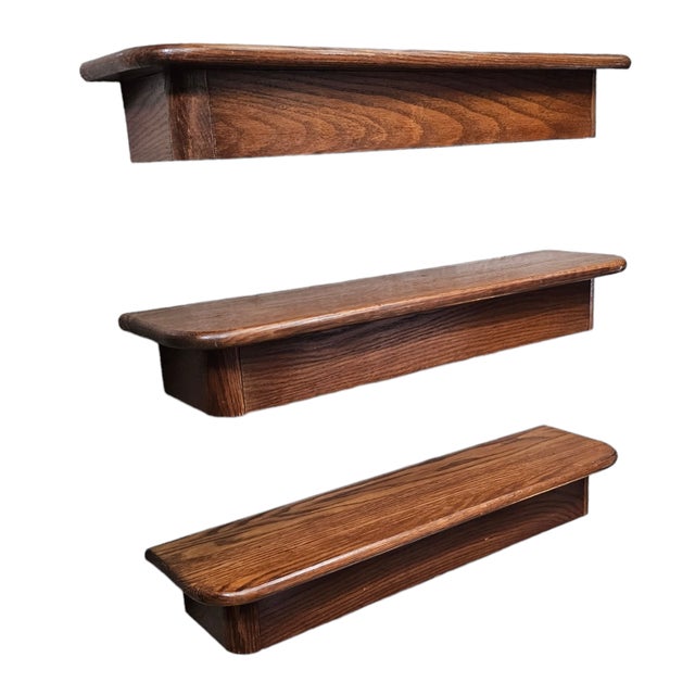 Two Beautifully patinated original finish oak floating shelves. These phenomenal shelves great for mid century or...