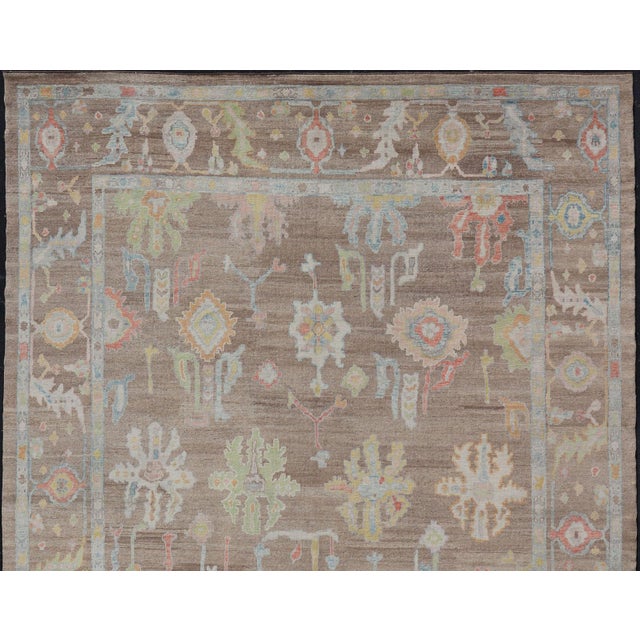 Measures: 13'4 x 17'6 Turkish Oushak Rug with All-Over Floral Design On A Light Brown Field. Keivan Woven Arts / rug...