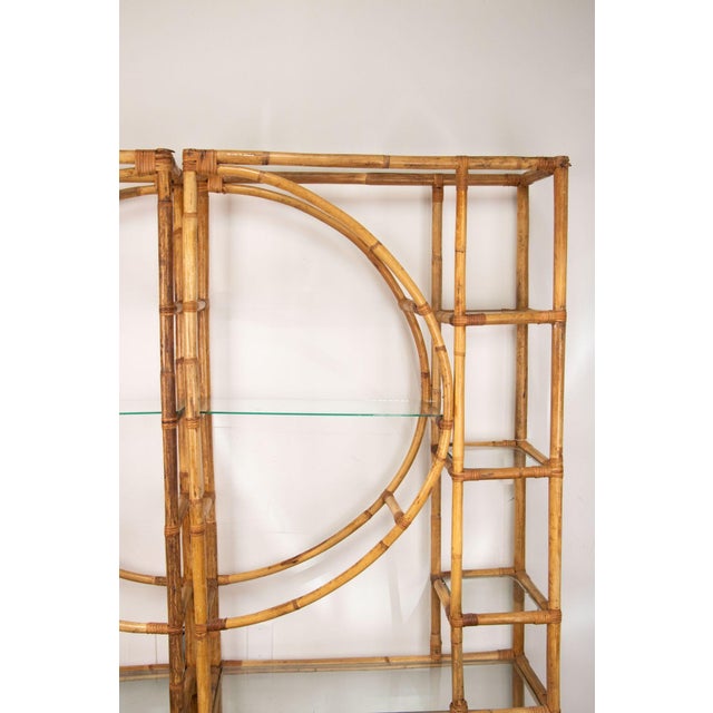 A lovely two-piece bamboo etagere with graphic half moon design. Fourteen glass shelves of various sizes and shapes allow...