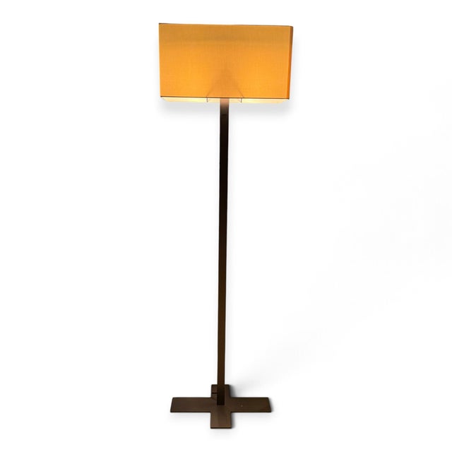 Leukon floor lamp designed by Antonio Citterio for B&B Italia. Distinctive modern silhouette, rubbed bronze finish, and...