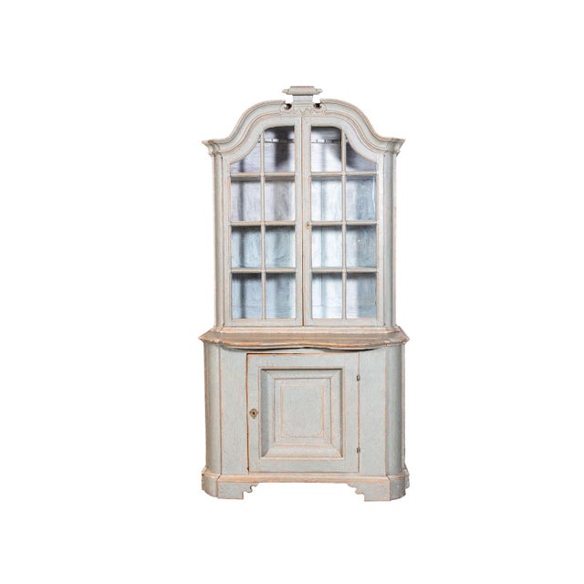 Gustavian pale blue-gray painted hutch. Arched bonnet top with with carved crest detail. Shaped pull-out work ledge over...