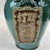 A beautiful and unusual wine jug in a turquoise and blue glaze. The front panel with Chinese writing indicates a type of...