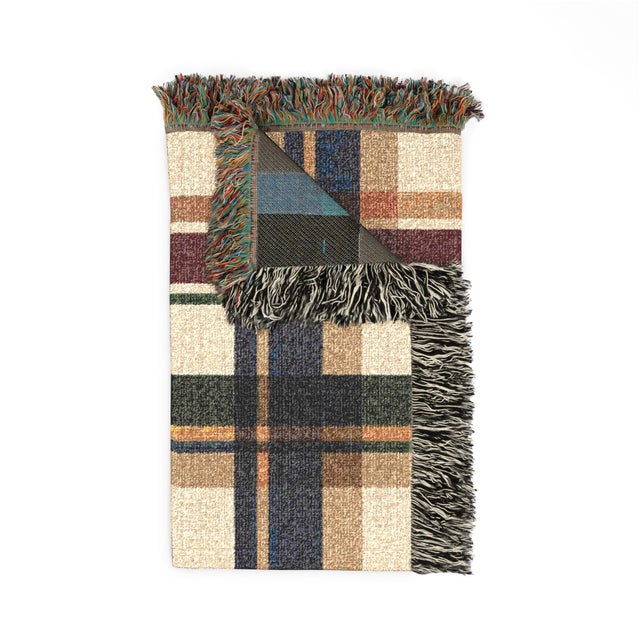 This classic tartan plaid woven throw blanket features intersecting bands of navy, forest green, burgundy, and camel on...