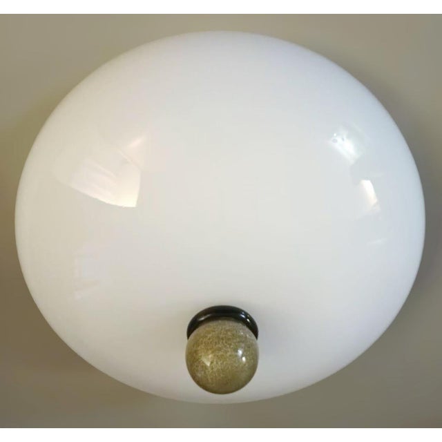 Vintage Italian flush mount with a milky white glass shade and a black with amber glass finial / Made in Italy in the...