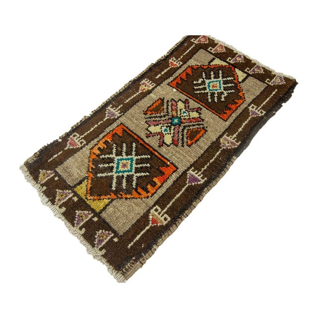 Vintage Handknotted decorative mini rug from Kars region of Turkey. Approximately 45-55 years old. In very good condition.