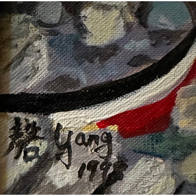 This 1998 oil on canvas of boats on a rocky shore with looming mountains in the background is signed “Yang” in both...