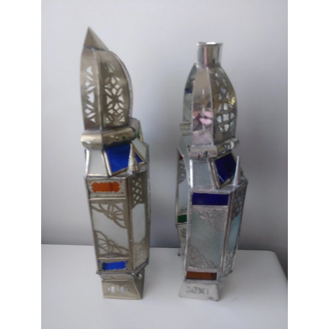 Casting light in intricate and decorative patterns as you light the room with this pair of Handmade Moroccan Colored Glass...