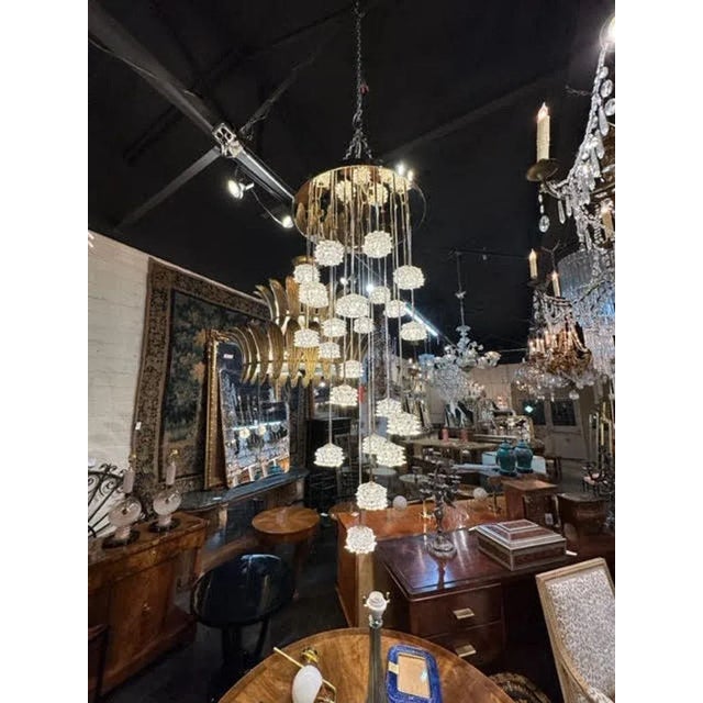 Fabulous modern Murano glass rostri cup suspension chandelier. The cups are dangling at different lengths and are...