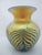 Lundberg Studios, California hand blown glass vase. Features an intricate glass-blowing technique that create a...