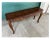 A classic French provincial sofa console table with a parquet top and a floral carved apron fading gradually into cabriole...