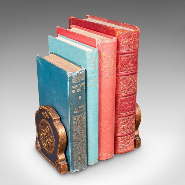 This is a pair of small vintage Baroque revival bookends. An Italian, giltwood decorative book rest, dating to the late...