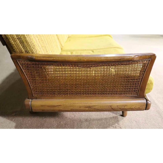 Long Mid-Century Modern sofa designed by Karl-Erik Ekselius. Sculpted walnut frame in the style of Adrian Pearsall's...