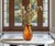 Standing an impressive 12 1/2 inches tall, this striking hand-blown art glass vase showcases a bold freeform silhouette...