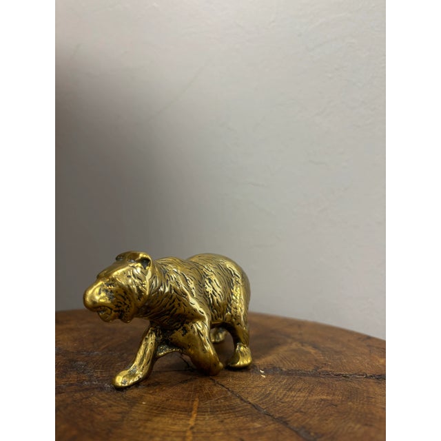 This vintage English brass bear figure is a beautifully rendered example of fine casting and timeless craftsmanship. The...