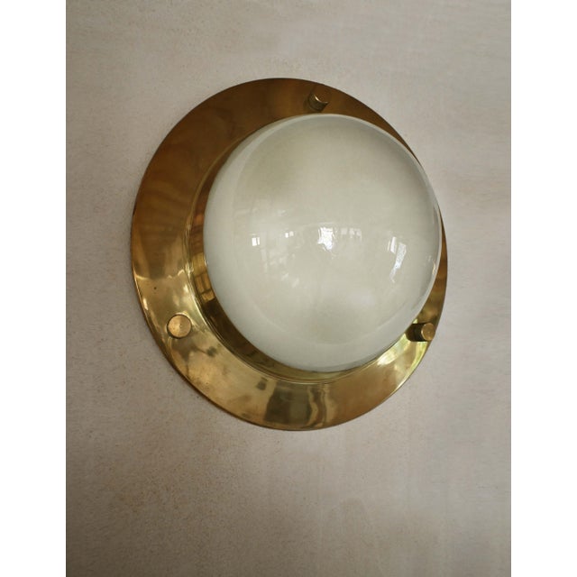 An elegant and versatile wall or ceiling lamp, model LSP6 "Tommy," designed by Luigi Caccia Dominioni and produced by...