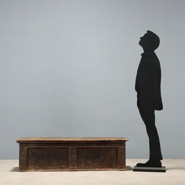 Archaic chest made in the 17th century. Made of walnut, with an opening top held in place by ring hinges, a split front...