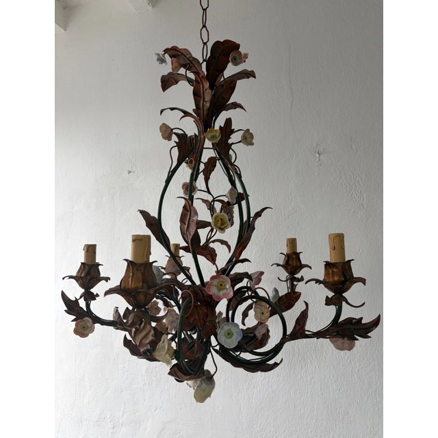 Housing 5 lights, sitting in gilt metal. Big multi color brown, black and yellow fall leaves throughout. Adorning hand...