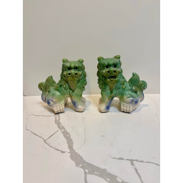 Pair of either Shisa or Komainu Foo Dogs or Fu Dogs ready to stand guard over your home. Glazed ceramic porcelain in a...