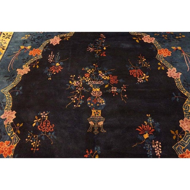 Antique Peking Room Size Wool Blue, Red Rug, Circa Date: 1900s. This exquisite example of early 20th-century Chinese...