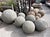 Rustic stone garden sphere hand-carved from granite. Each slightly unique in natural textures, tones and patina. A...
