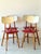 A 1960s ash wood TON chair with a seat height of 44.5 cm. While the overall color is coordinated, the red seat and beige...