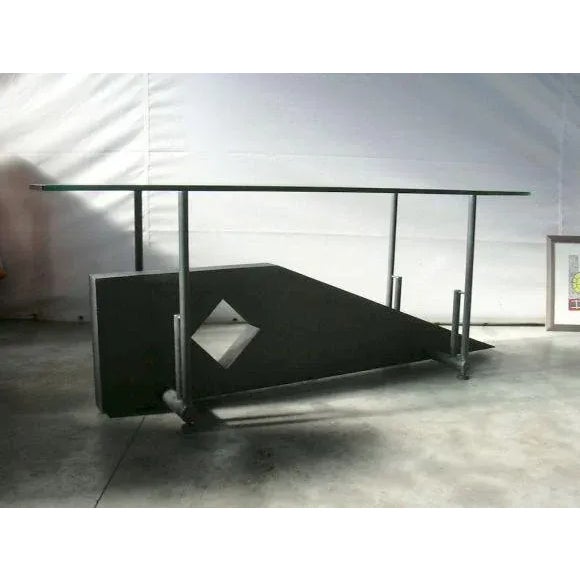 Sculptural iron base with thick glass top