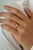 This solitaire ring features a 0.28 carat of marquise-cut diamond set in 14K yellow gold The diamond measuring 3.2 x 5.5...
