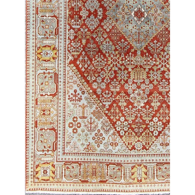 Antique Persian Joshegan rug with geometric medallion design in rust/red and ivory, Keivan Woven Arts / rug 17-0807,...