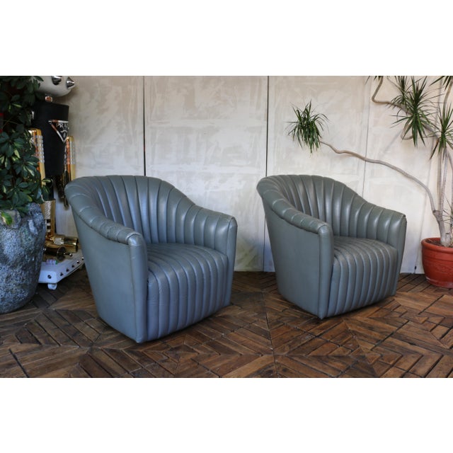 A striking vintage pair of channel-tufted club chairs manufactured by Martin/Brattrud Inc. in 1987, a maker well known for...
