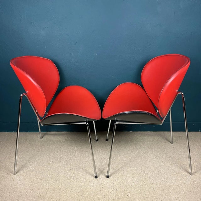 Add a touch of hot red to your home with this stunning pair of chairs, inspired by Pierre Paulin's original 1960s design,...
