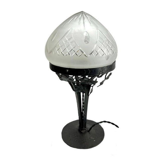 The 1930s, Brlgium A wonderful Belgium Art Nouveau lamp. The stands are handmade in wrought iron with black finish patina...