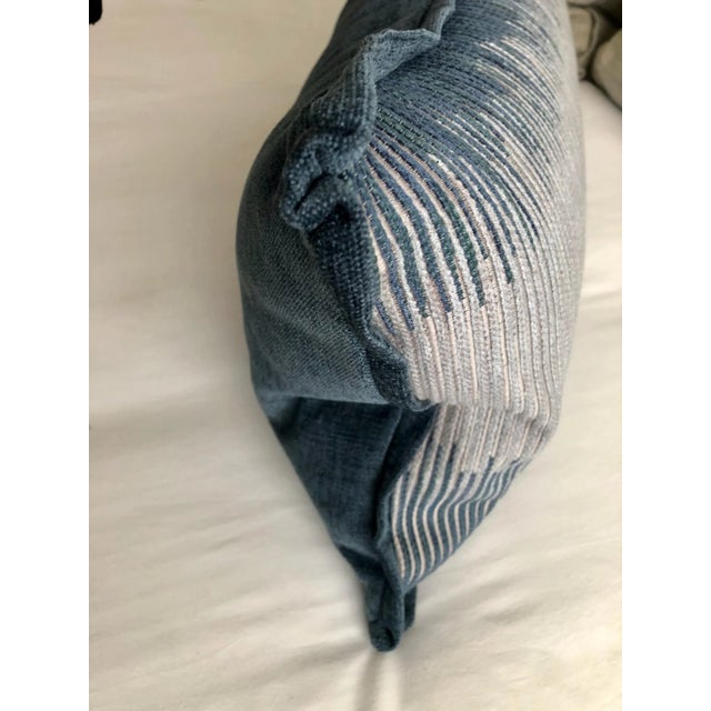 Ombre stripe chenille throw pillow. Accented with a contrast flange trim and solid blue back. Pillow includes "angel hair"...