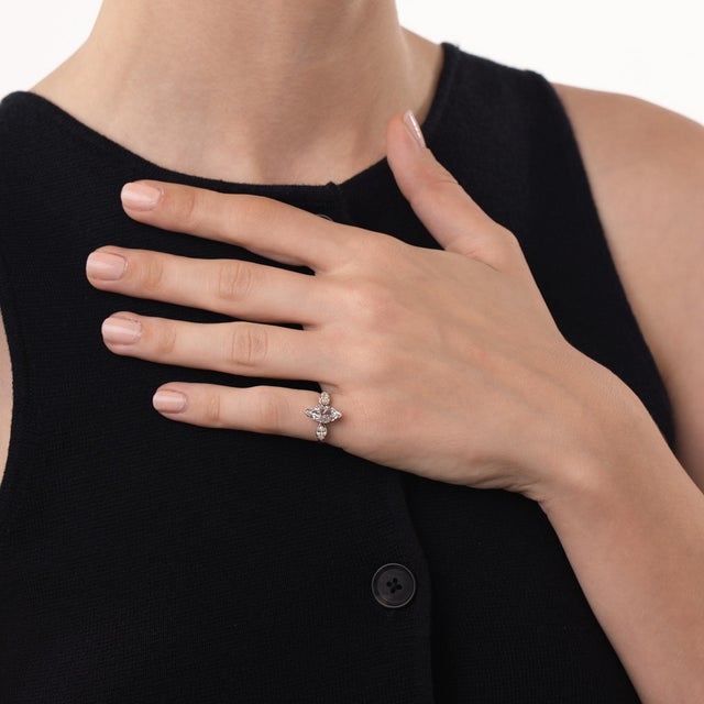 This elegant Mid Century diamond engagement ring is a timeless 1950’s design, centered by a GIA-certified marquise...