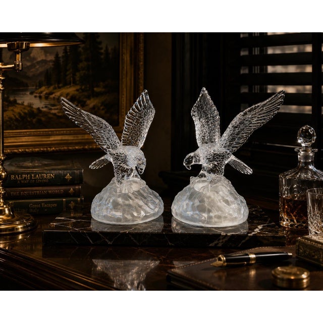 A dramatic pair of vintage Cristal d’Arques sculptural crystal eagles from France, executed with striking movement, deeply...