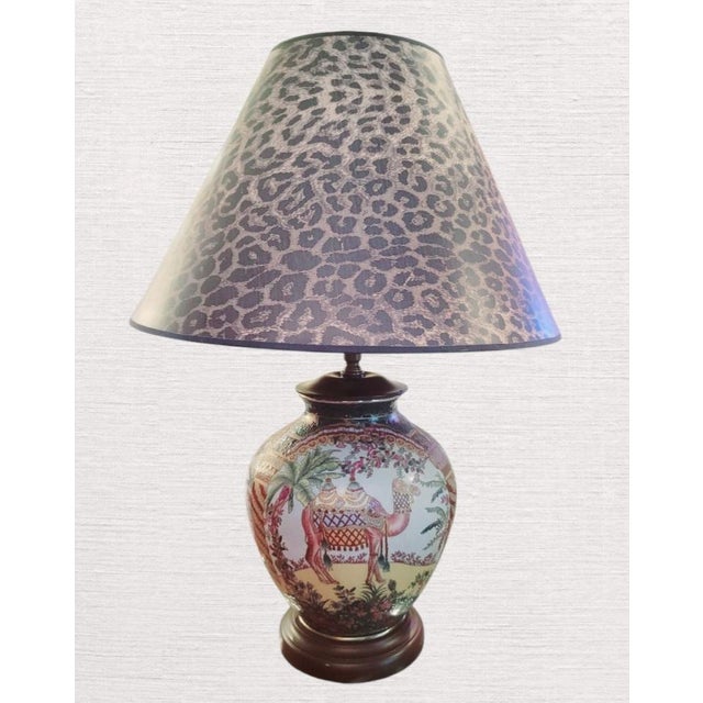 A beautiful very colorful Chinoiserie ceramic ginger jar style camel table lamp. The lamp features a stunning tropical...
