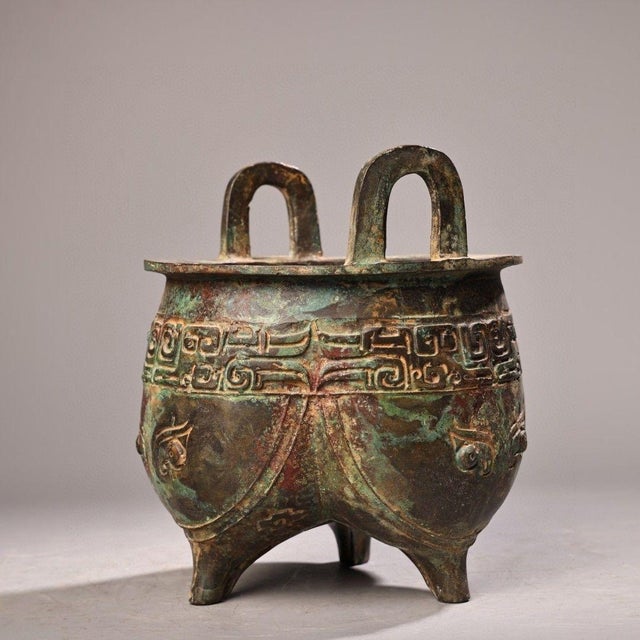 This is a striking vintage Chinese bronze tripod cauldron, known as a Ding, crafted in the archaic ritual style of the...