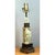This vintage table lamp centers on a hand-carved column of pale green jadite, its cylindrical form pierced and sculpted...