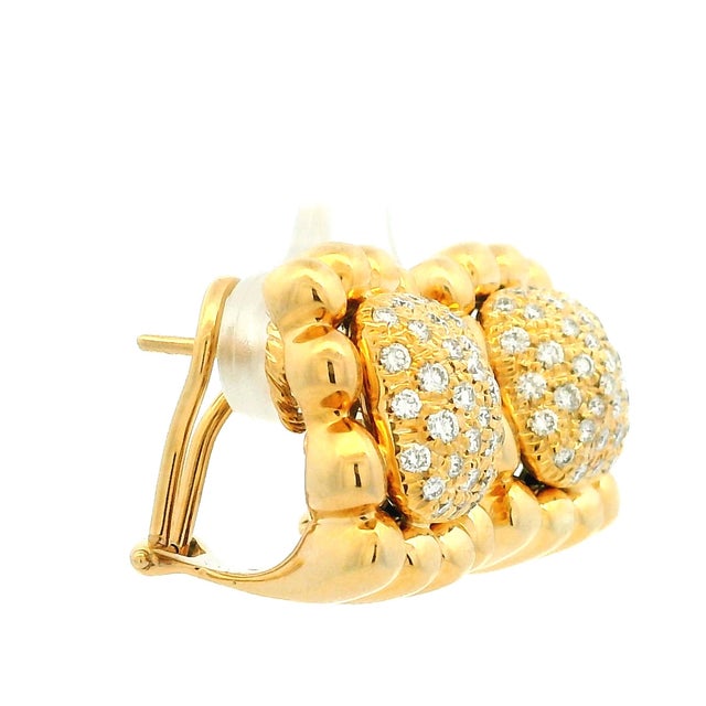 Vintage earrings made in Italy by Primoro, crafted in 18 karat yellow gold with pavé-set diamonds across domed centers....