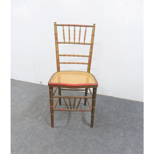 Faux Bamboo side chair , gold painted distressed finish, caned seat
